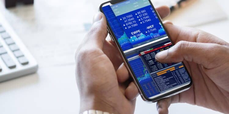 Businessman checking stock market online